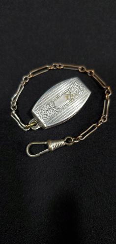 Offered is an outstanding and unique pocket watch chain fob circa 1890's. The chain measure, from end-to-end, 5 inches and is silver tone. The links are strong and attractive! The end hook and swivel are strong and mechanically sound and will securely hold your time piece or locket for many years to come. The clip can accommodate a 1 inch belt, and the chain is 4 inches long.  As you can see from the picture, the item has a lovely coat or patina that took over 120 years to form. Many people appr Vintage Silver Pocket Watch For Wedding, Vintage Silver Pocket Watch With Chain, Vintage Medallion Pocket Watch For Wedding, Vintage Medallion Pocket Watch For Weddings, Antique Medallion Pocket Watch For Wedding, Antique Locket Pocket Watch For Wedding, Antique Engraved Pocket Watch For Wedding, Antique Wedding Pocket Watch, Vintage Silver Pocket Watch Collectible