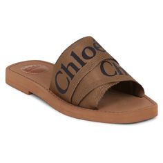 Description The Chloe Woody Logo Slide In Grove Brown Is A Slip-On Style Flat And Features The Iconic Chlo Logo Centrally Printed On The Ribbon Strap. Fabrication: 100% Polypropylene Chic Brown Slides With Leather Footbed, Chic Brown Slides With Leather Sole, Designer Brown Slides For Spring, Chic Brown Round Toe Slides, Chic Brown Slides With Round Toe, Chic Brown Flat Sandals, Chic Flat Brown Sandals, Designer Brown Sandals For Spring, Bag And Shoes Closet