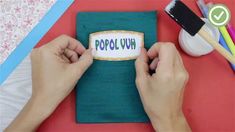 someone is holding up a small piece of paper with the word popluw on it