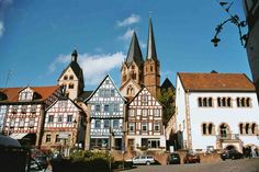 an old european town with tall buildings and steeples