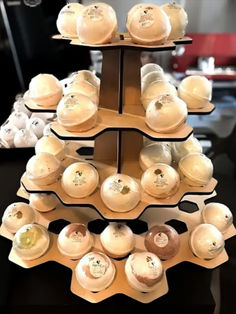 there is a display with many hats on it's shelves in the store that are stacked high