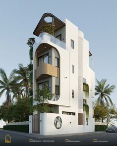 a large white building with lots of windows and balconies on the top floor