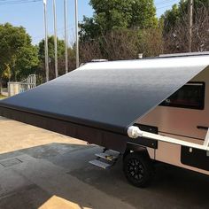 a small camper parked in a parking lot