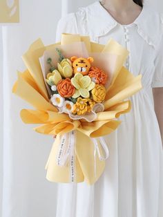 a woman in white dress holding a bouquet of flowers with teddy bears on the side