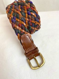 Very cool braided, woven leather belt with colorful fabric. This one has a nice width, a bit thicker than some of the others I have listed right now. It has a good authentic style about it. Well made. No flaws noticed. Brass buckle  It is a more "open size " because it has no actual punch holes. Looks best at or around 32"-34" waist setting.  Belts: I measure length of strap and then to assure fit, I measure from the tooth to the punch holes. Please measure your actual waist. It's not accurate t Casual Brown Woven Belt, Vintage Adjustable Multicolor Belts, Casual Brown Woven Leather Belt, Casual Multicolor Fabric Belt, Casual Multicolor Adjustable Belt, Adjustable Multicolor Leather Belts, Colorful Fabric, Cool Braids, Brass Buckle