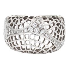 Stylish vintage Cariter ''Nouvelle Vague'' diamond ring crafted in 18 karat white gold (circa 2000).   Round brilliant cut diamonds total an estimated 0.35 carats (estimated at F-G colour and VVS2 clarity).    The out of production Cartier highlights an openwork lattice design with a low dome, sprinkled with diamonds. The ring rises 5mm from the finger (0.19 inches). The ring is great worn alone or stacked with your fine jewellery from any era.   The ring is in very good condition. We have not c Paris Ring, Cartier Jewelry, Lattice Design, Ring Crafts, Domed Ring, Ring Diamond, Fine Jewellery, Round Brilliant Cut Diamond, Brilliant Cut Diamond