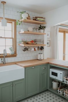 the kitchen is clean and ready to be used for cooking or baking, while also being used as a storage space