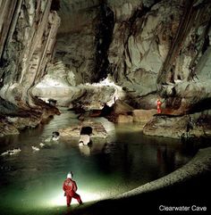 a man standing in the middle of a cave