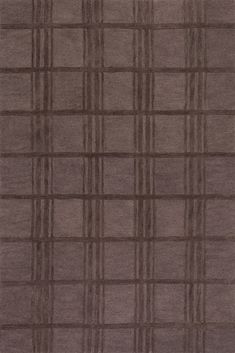 an area rug with squares and lines on the side, in dark brown color scheme