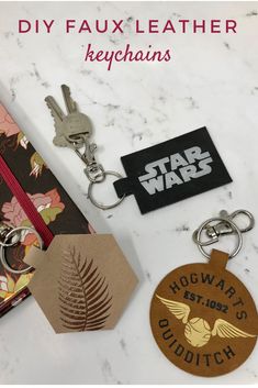 star wars keychains and tags are sitting on a marble surface with the words diyfaux leather keychains