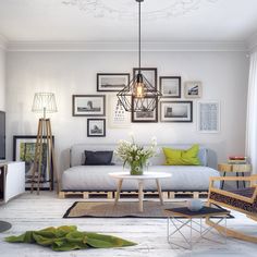 a living room filled with furniture and framed pictures on the wall above it's coffee table