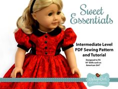 the doll is wearing a red dress with black trim