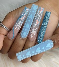 Extra long blue acrylic nails 
Winter  nails with heart and snowflake designs. Glitter nails Blue Christmas Nails, Long Acrylic Nail Designs, Blue Acrylic Nails, Winter Nails Acrylic, Drip Nails, Pink Winter, Long Acrylic Nails Coffin, Christmas Nails Acrylic, Long Square Acrylic Nails