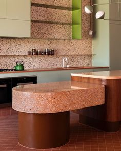 a kitchen with an island and counter top