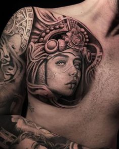 a man's chest with tattoos on it and an image of a woman wearing a headdress