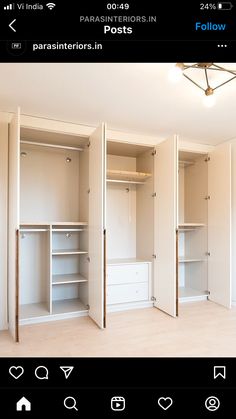 an empty room with white closets and shelves