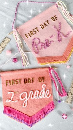 the first day of school embroidered on pink and white fabric with measurings next to it