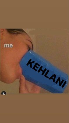 a child drinking from a blue cup with the word kehlani on it