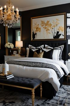 a black and white bedroom with chandelier, bed, nightstands and painting on the wall