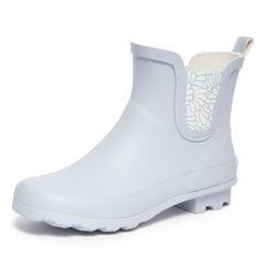 PRICES MAY VARY. Stay Dry in Style: Laura Ashley ladies mid cut ankle height rubber rain boots offer both fashion and function. Keep your feet dry and stylishly protected from the elements with these chic waterproof booties, perfect for rainy days or outdoor activities. Comfortable All-Day Wear: Designed for comfort, these rain boots feature a cushioned insole and fabric lining to keep your feet cozy and supported, even on the longest of rainy days. The round toe and wide cuffs ensure a comforta Spring Waterproof Ankle Boots, Waterproof Ankle-high Boots For Spring, Waterproof Ankle Rain Boots For Spring, White Waterproof Rain Boots For Spring, Waterproof White Boots For Spring, White Waterproof Boots For Spring, Weatherproof Spring Rain Boots, Chelsea Cut, Booties For Women