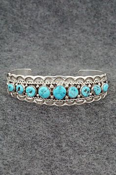 This stunning Kingman turquoise and sterling silver bracelet was made by Navajo silversmith Anthony Brown. The inside of the cuff is signed Anthony B and stamped sterling.Size: 5 1/2" (will fit up to a 6 5/8" wrist)Gap: 1 1/8"Width: 3/4"Free shipping on all orders! We ship with USPS and always include tracking. All orders ship within a day of payment.Returns are accepted up to 30 days after you receive your order. Just send us a message. Our shop offers cash back or store credit. The item must be returned in new condition. Western Style Blue Bangle Jewelry, Southwestern Sterling Silver Cuff Bracelet In Blue, Southwestern Style Stamped Turquoise Bracelets, Southwestern Style Stamped Blue Bracelets, Southwestern Style Turquoise Stamped Bracelets, Southwestern Turquoise Bangle, Western Style Collectible Bangle Bracelets, Southwestern Style Turquoise Bracelet Stamped 925, Southwestern Blue Concho Bracelets