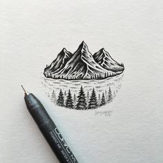 a pencil drawing of mountains and trees on white paper with watercolor pen in the foreground