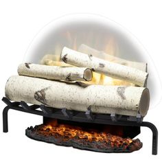 an outdoor fire pit with logs stacked on it's sides and flames coming out