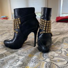 Worn A Few Times, Black Rocker Boots. 1/2” Platform, 4-1/2 Heel. Back Zip. Studs Strap On And Can Come Off To Be Worn Without. Beautiful Bootie! Edgy High Ankle Boots With Studs, Black Ankle Heeled Boots With Rivets, Black Riveted Ankle Boots, Punk Boots With Studded Rubber Outsoles And Pointed Toe, Edgy Studded Ankle-high Boots, Edgy Ankle Moto Boots With Spikes, Edgy Spiked Ankle Moto Boots, Punk Ankle Boots For Party, Punk Style Ankle Boots For Party