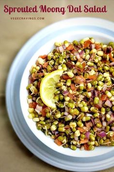 a white bowl filled with food on top of a table