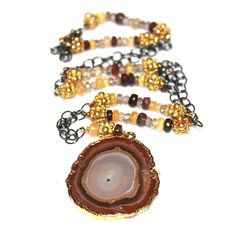 "This agate necklace is a gorgeous combination of sparkling black and gold. A gold dipped agate slice is paired with natural black and white Ethiopian opal and shimmery zircon with gold vermeil accents. This necklace is adjustable to approximately 20.5\". Gorgeous! FizzCandy, in association with The Artisan Group®, participated in GBK's invitation-only luxury celebrity gift lounge honoring the nominees and presenters for the 2017 Golden Globes. The gift lounge took place on January 6-7, 2017 in Agate Slice Necklace, Raw Opal Ring, Jewelry Stacking, Grey Diamond Ring, Necklace Everyday, Druzy Jewelry, Candy Jewelry, Stacked Necklaces, Agate Slice