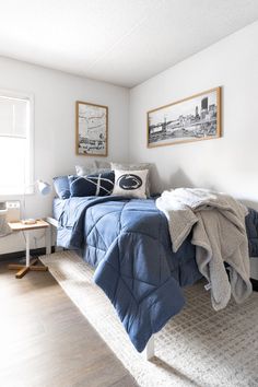 a bed sitting in a bedroom next to a window