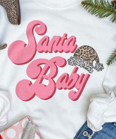 Get in the holiday spirit with this Santa Baby Graphic Shirt . This festive design pairs perfectly with leggings, a vest, and booties! Show your Christmas spirit in a big way this year. Available in youth to adult. *6.0 oz., pre-shrunk 100% cotton *Double-needle stitched neckline and sleeves*Quarter-turned*Seamless seven-eighths inch collar*Taped neck and shoulders*Satin label*Rib cuffs Baby #5, Festive Design, Santa Baby, Graphic Shirt, Christmas Spirit, Graphic Shirts, Holiday Spirit, The Holiday, This Year