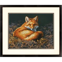 a cross stitch picture of a red fox laying in the grass with its eyes closed