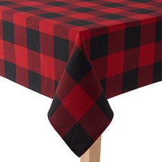 a red and black checkered tablecloth on a wooden stick