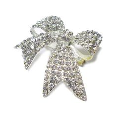 This Rhinestone Brooch features a classic ribbon style. Versatile and ready to use for floral centerpieces, displays, and crafts. Le Prise™ Color: Silver | Le Prise™ Fakenham Rhinestone Brooch 2.0 H x 2.0 W x 0.5 D in Metal in Silver | 2" H X 2" W X 0.5" D | Wayfair White Rhinestone Brooches For Formal Occasions, Formal White Brooches With Rhinestones, Formal White Rhinestone Brooches, Silver Brooch With Decorative Bow For Party, Silver Brooch With Decorative Bow, Silver Bow Brooch For Wedding, Silver Brooches With Decorative Bow, Elegant Crystal Pins For Party, Rhinestone Pins For Wedding