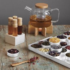 an assortment of teas and spices on a tray