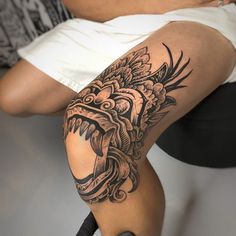 a person with a tattoo on their leg