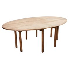 an oval wooden table with two legs