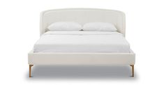 a bed with white sheets and pillows on it's headboard, in front of a white background