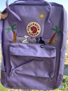 Welcome to my store and choose the perfect hand-embroidered fjallraven kanken backpack   Version & Size + Medium size: 38x27x13cm  + Big size: 42x32x13cm  - Product price includes: hand-embroidered fjallraven kanken backpack and design as shown in the picture - I can make fjallraven kanken backpack hand embroidery patterns according to your ideas - fjallraven kanken backpack will be hand embroidered with thread that won't fade when washed - fjallraven kanken backpack has a small front compartmen Trendy Embroidered Backpack For Travel, Casual Backpack With Embroidered Logo, Casual Everyday Backpack With Cat Design, Kanken Sling, Kanken Classic, Fjall Raven, Cat Embroidery Design, Fjällräven Kånken, Embroidered Backpack