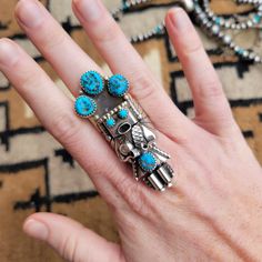 Authentic Turquoise set in Sterling Silver This Turquoise Kachina Ring was handmade by amazing Native American Artist Doris Smallcanyon. Size 8.75 2.25" long Artisan Multi-stone Turquoise Ring, Collectible Blue Multi-stone Turquoise Ring, Turquoise Multi-stone Ring For Gift, Unique Turquoise Multi-stone Rings, Collectible Multi-stone Blue Turquoise Ring, Unique Blue Turquoise Multi-stone Ring, Unique Turquoise Ring Jewelry, Unique Blue Turquoise Ring With Inlay, Collectible Turquoise Jewelry With Large Stone