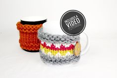 two knitted coffee mug cozyies sitting next to each other