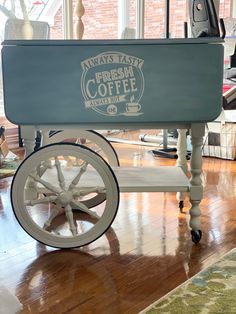 a coffee cart sitting on top of a hard wood floor