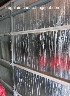 the inside of a building that has some kind of metal mesh covering it with red wire