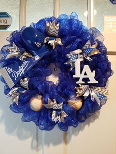 a blue wreath with baseballs and a number on it