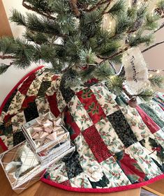 a quilted christmas tree skirt on top of a table