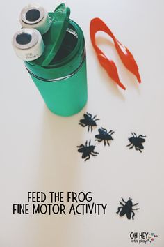 a green cup filled with scissors next to some black bugs on a white surface and the words feed the frog / fine motor 1