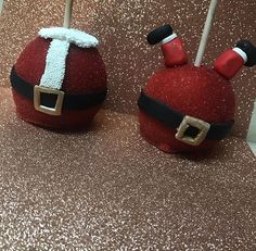 two red santa hats on top of cake pops