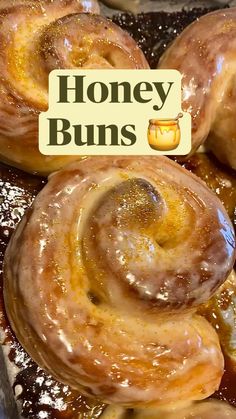 honey buns are sitting on top of each other in front of a sign that says honey buns