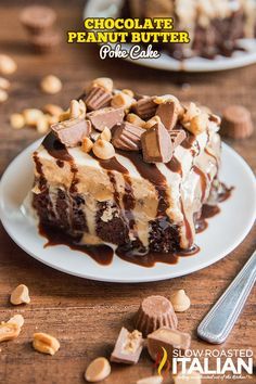 a piece of chocolate peanut butter poke cake on a white plate with nuts around it